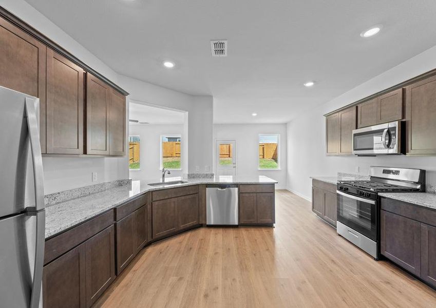 The kitchen has sprawling granite countertops.