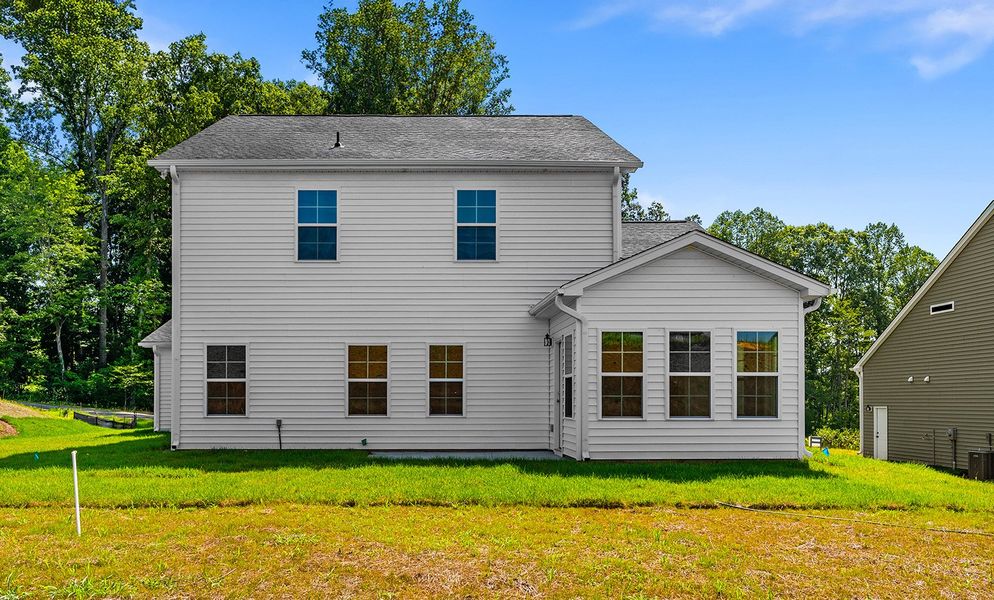 Front exterior of a new home in Brooke Hill, Lewisville, NC, highlighting curb appeal (Image 27). Front exterior of a new home in Brooke Hill, Lewisville, NC, highlighting curb appeal (Image 27).