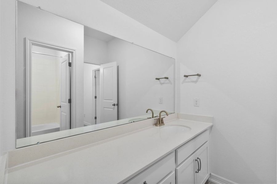 Thoughtfully designed, this secondary bedroom provides versatility with an oversized vanity. Thoughtfully designed, this secondary bedroom provides versatility with an oversized vanity.