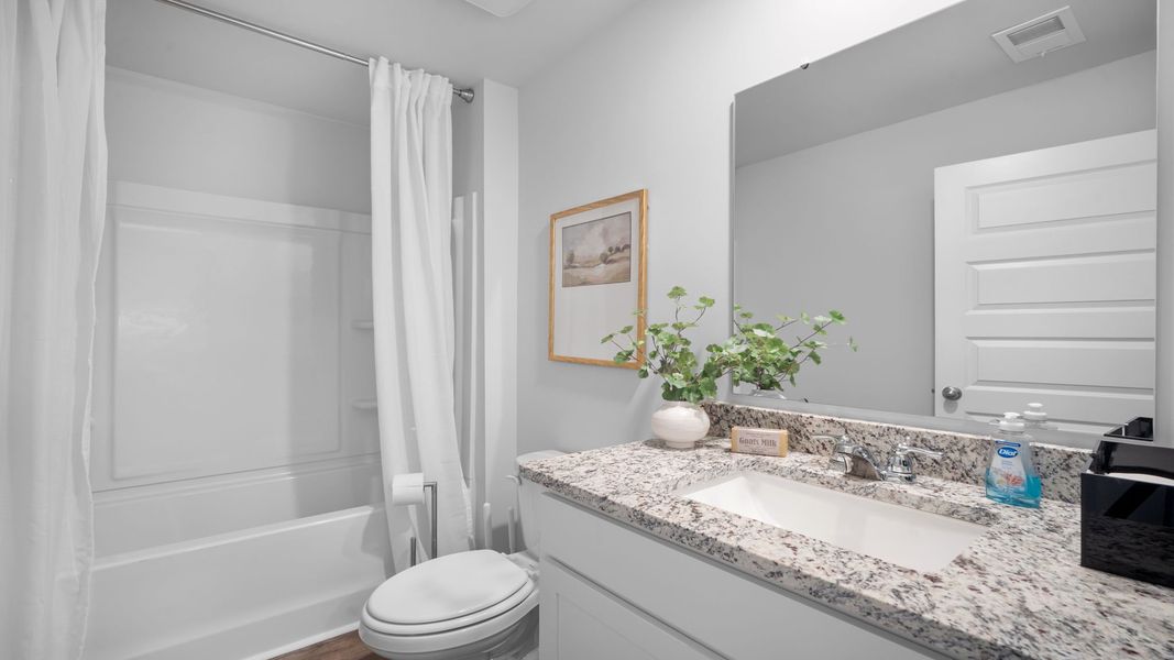 Representative furnished interior of a home built from the Cali by D.R. Horton in Palm Ridge, Guyton (Image 10).