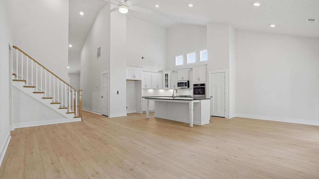 Spacious and stylish family room with two-story ceilings that create a bright and open atmosphere in Greenville, SC