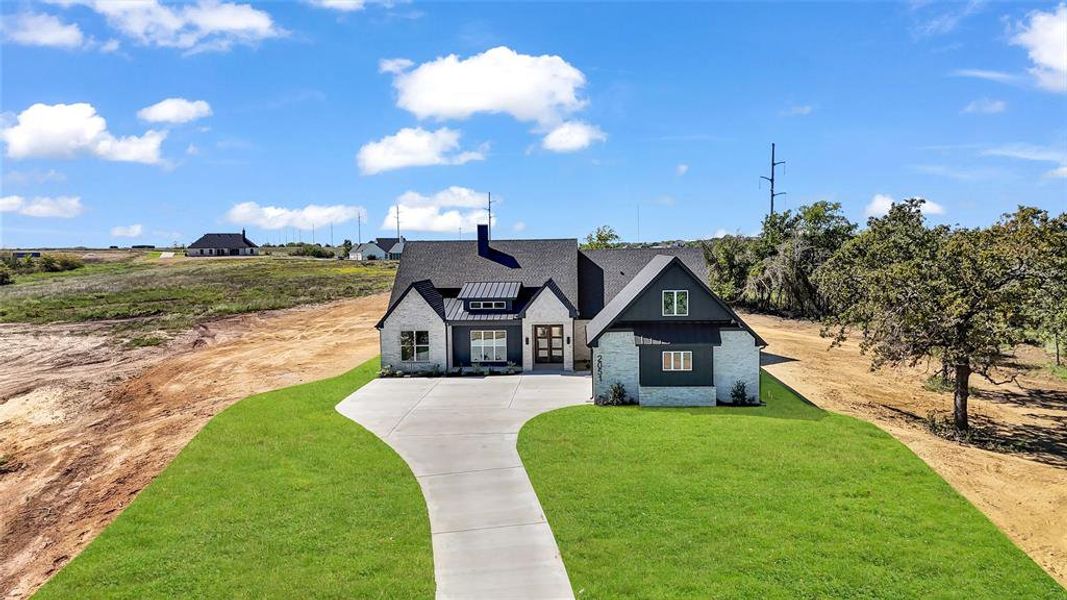 View of front of property featuring a front lawn