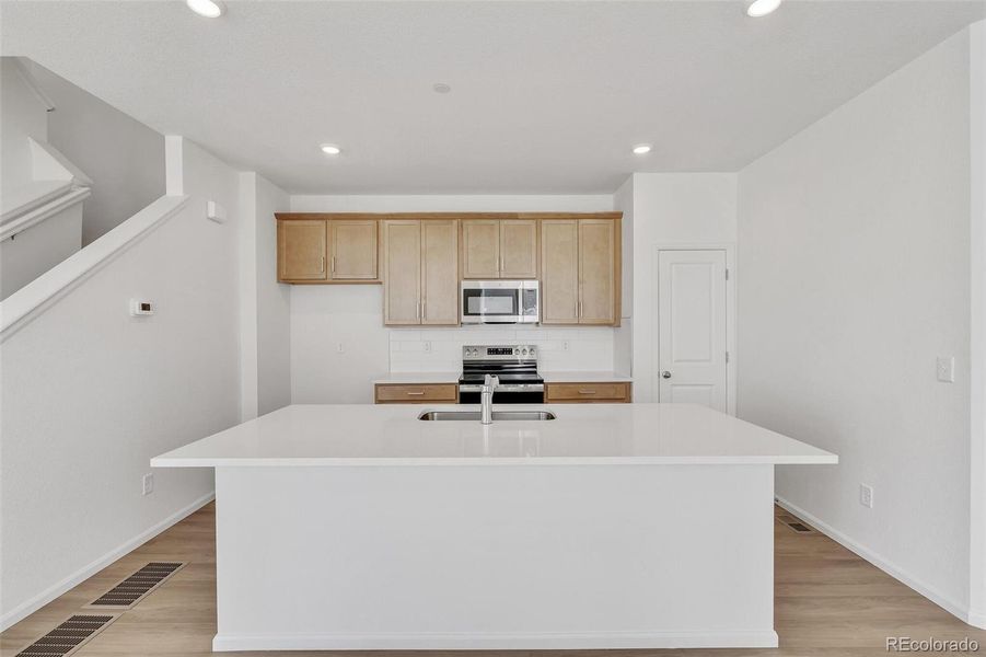 Furnished interior view inside a new home in Turnberry Villas, Commerce City (Image 8).