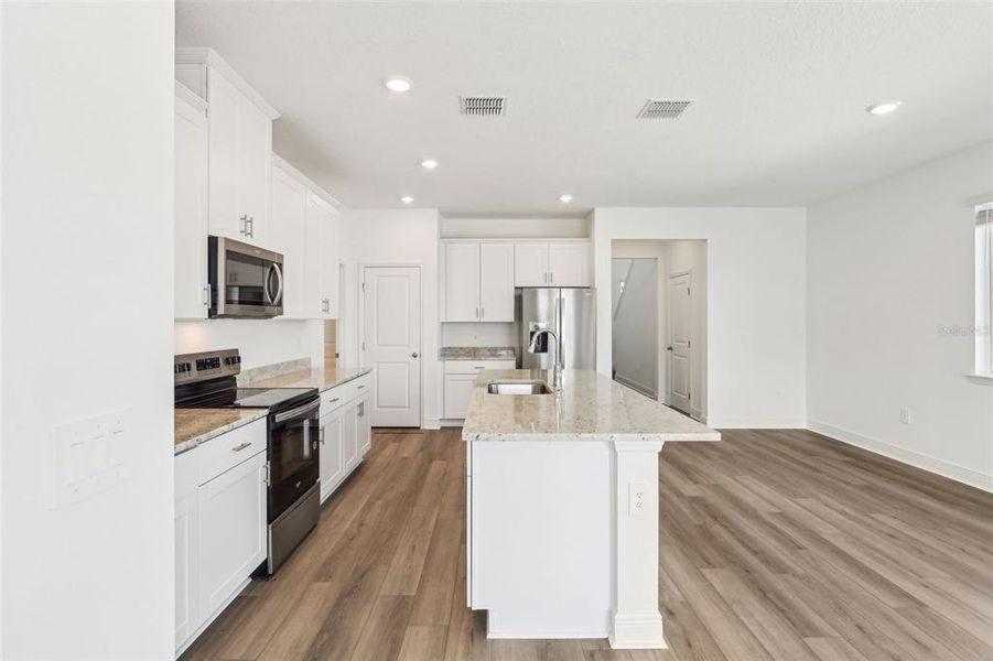 Furnished interior view inside a new home in Cyrene at Minneola - Villas, Minneola (Image 6).