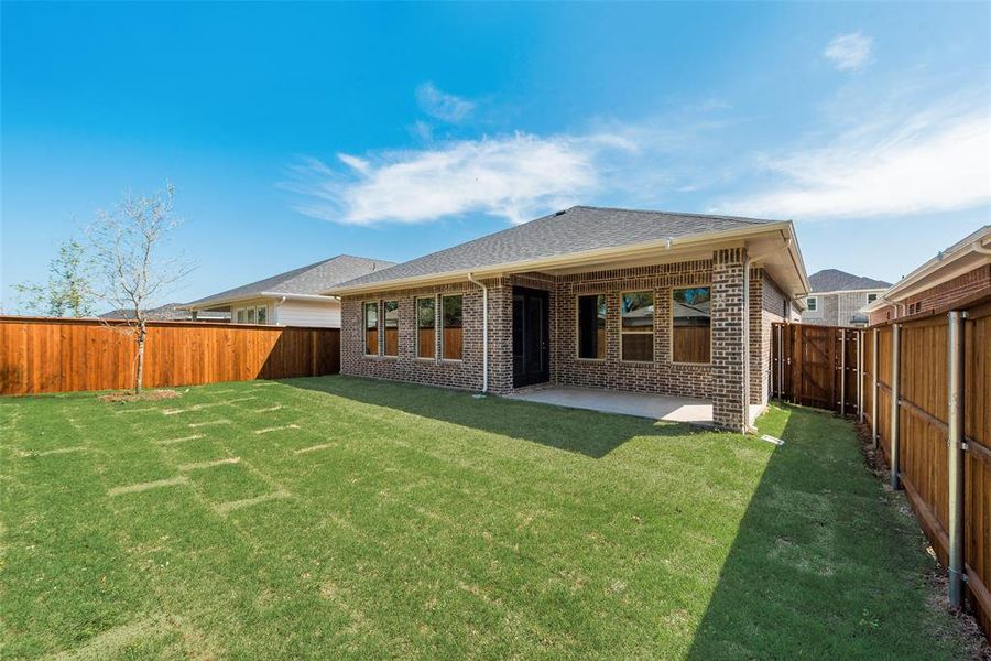 Front exterior of a new home in Bayside, Rowlett, TX, highlighting curb appeal (Image 2).