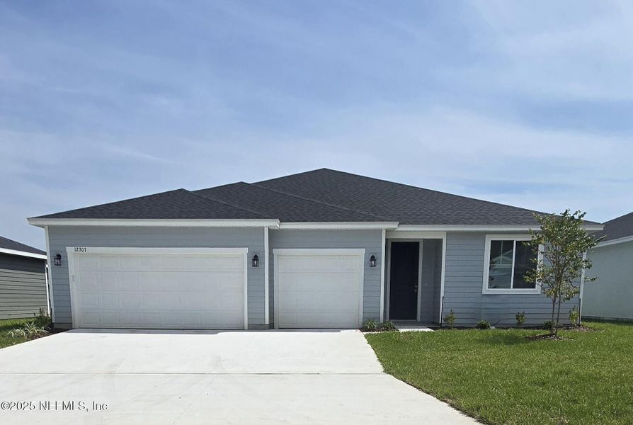 Front exterior of a new home in Azalea Creek, Jacksonville, FL, highlighting curb appeal (Image 24).