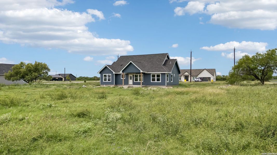 Front exterior of a new home in , Natalia, TX, highlighting curb appeal (Image 26).
