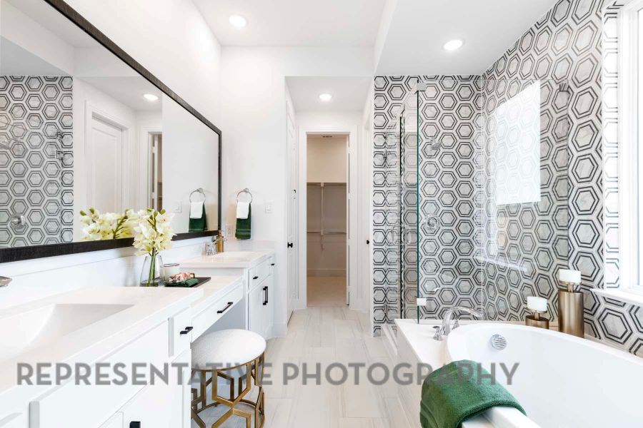 Full bath with recessed lighting, double vanity, a bath, a sink, and a spacious closet Full bath with recessed lighting, double vanity, a bath, a sink, and a spacious closet