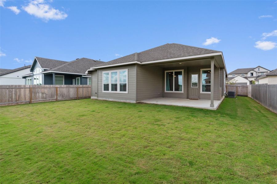 A spacious backyard  with a welcoming covered patio await.