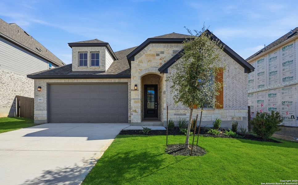 Front exterior of a new home in Bison Ridge, San Antonio, TX, highlighting curb appeal (Image 2). Front exterior of a new home in Bison Ridge, San Antonio, TX, highlighting curb appeal (Image 2).