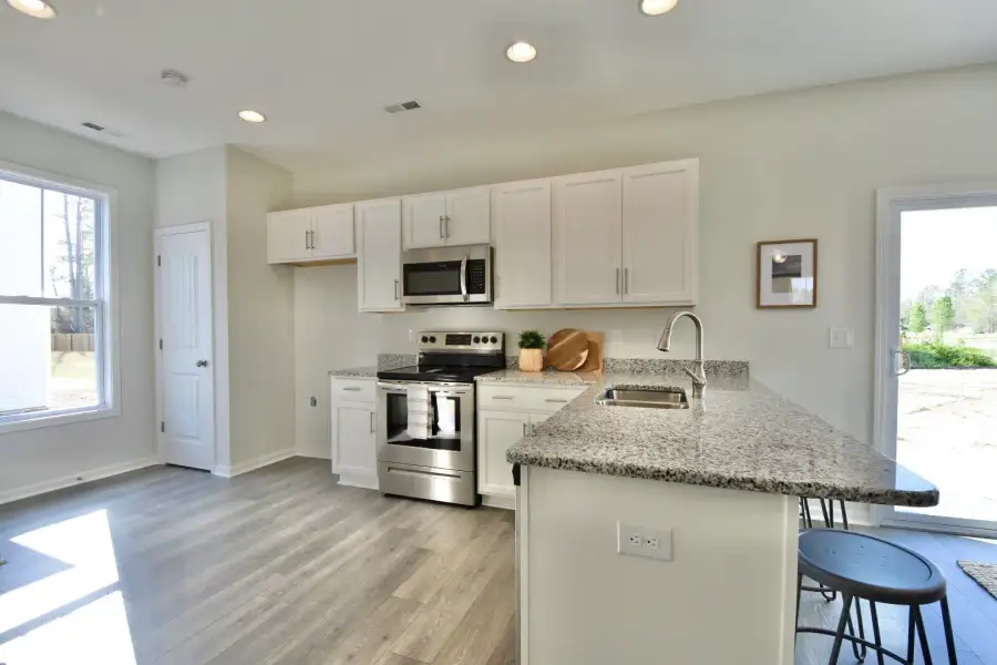 Furnished interior view inside a new home in Bristol Bay, Lake Waccamaw (Image 3).