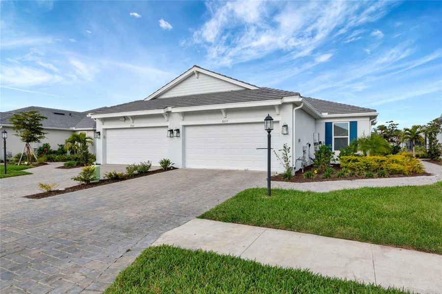 Front exterior of a new home in , Sarasota, FL, highlighting curb appeal (Image 25).