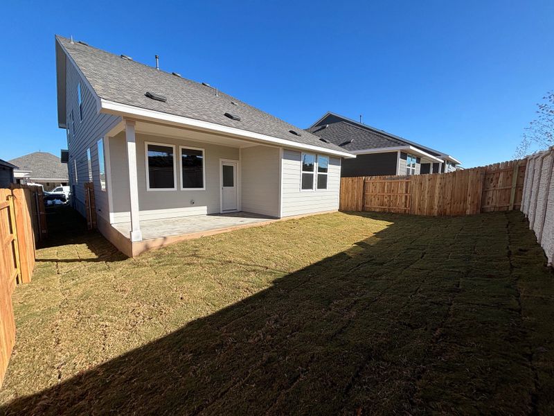 Exterior details and patio area of a home in Cannon Ranch 40s, Dripping Springs (Image 22).