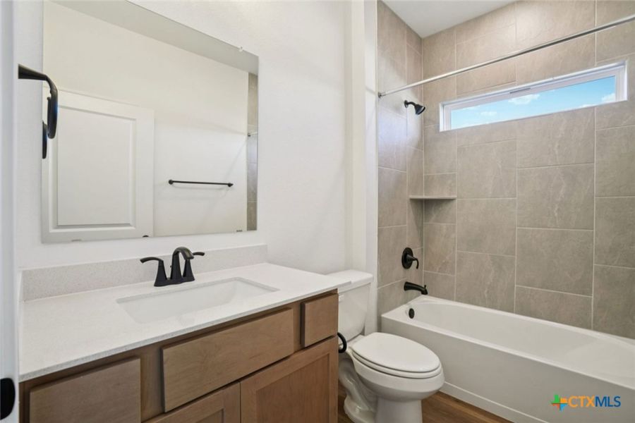 Furnished interior view inside a new home in Village at Three Oaks, Seguin (Image 10).