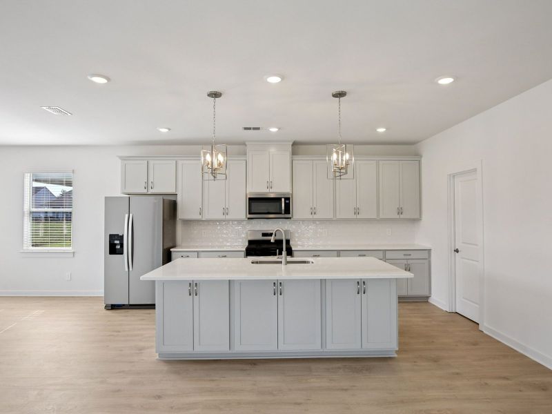 Prep dinner in the kitchen without missing the conversation in the great room.