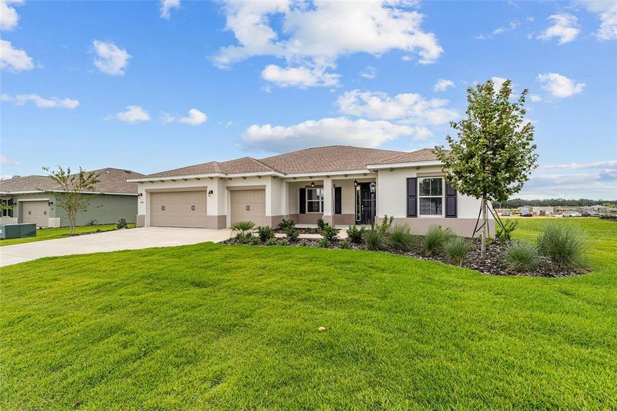 Exterior details and patio area of a home in On Top of the World Communities, Ocala (Image 4).