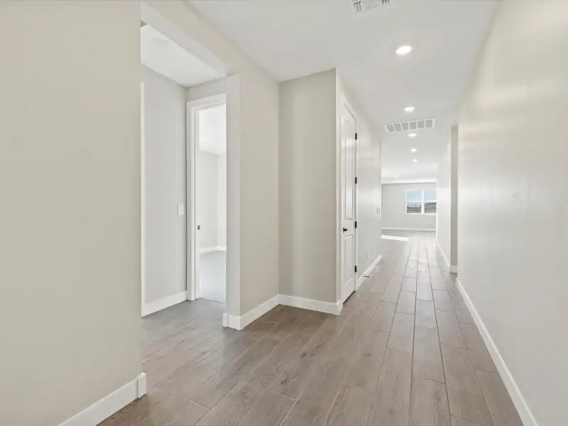 Spacious, unfurnished interior of a new home in White Tank Foothills Reserve Series, Waddell (Image 12). Spacious, unfurnished interior of a new home in White Tank Foothills Reserve Series, Waddell (Image 12).