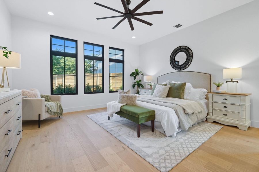 Bedroom with light wood-style floors, recessed lighting, and a ceiling fan