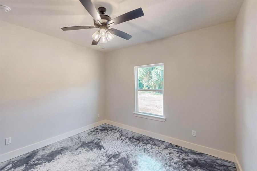 Spare room featuring ceiling fan