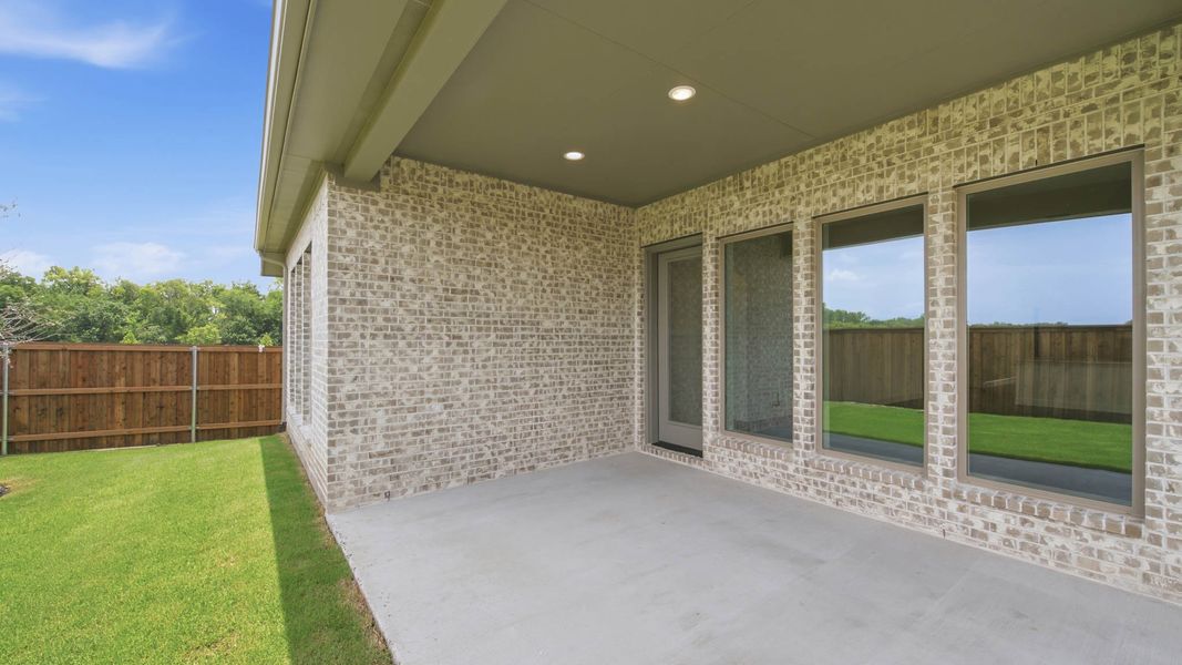 Exterior details and patio area of a home in Trinity Falls, McKinney (Image 4). Exterior details and patio area of a home in Trinity Falls, McKinney (Image 4).