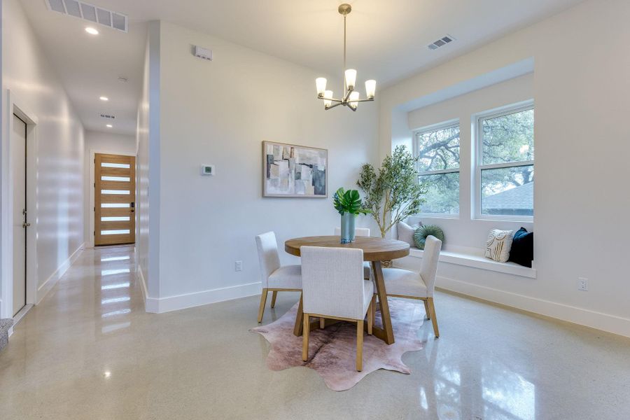 Large dining area with built in window seat.