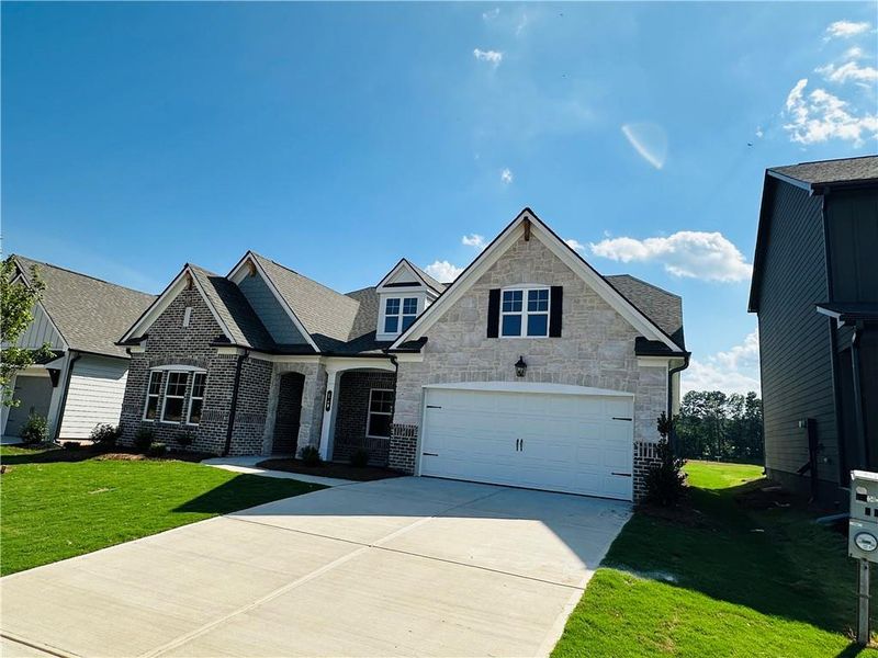 Front exterior of a new home in Summerlin, Winder, GA, highlighting curb appeal (Image 30).