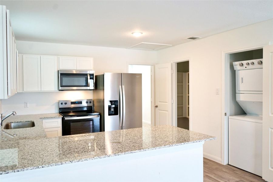 Furnished interior view inside a new home in , Conroe (Image 7).