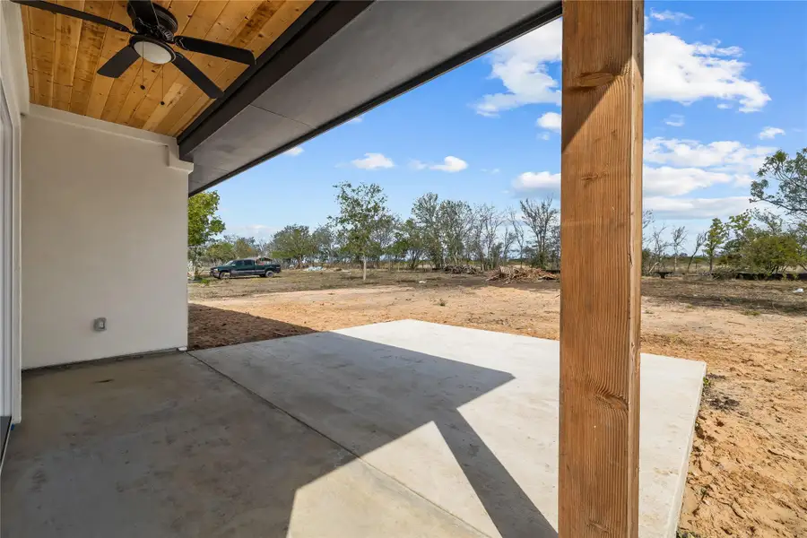 Covered back deck with extra backyard space