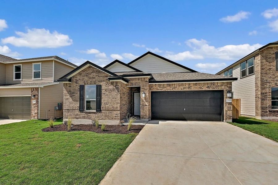 Front exterior of a new home in Hidden Trails, Belton, TX, highlighting curb appeal (Image 1).