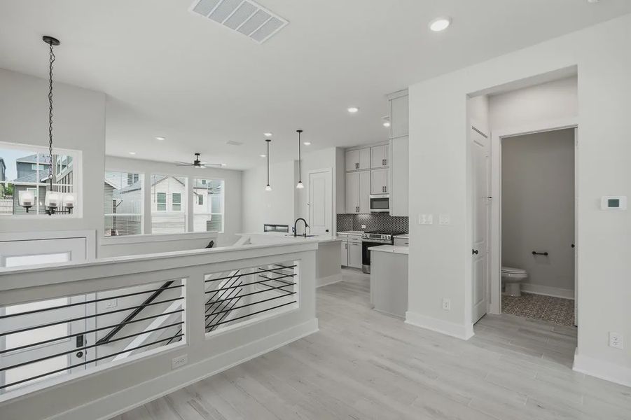 Furnished interior view inside a new home in Rose Hill, San Antonio (Image 13).