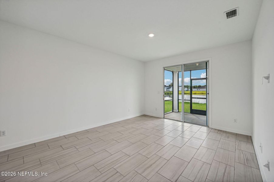Spacious, unfurnished interior of a new home in Lakes at Bella Lago - Signature Series, Green Cove Springs (Image 13).
