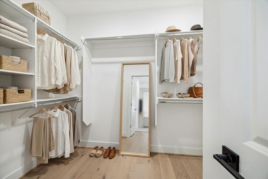 Expansive closet with custom shelving and storage solutions Expansive closet with custom shelving and storage solutions