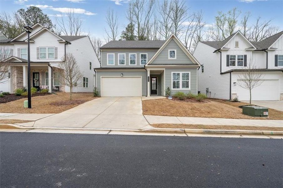 Front exterior of a new home in Enclave at Edgewater, Holly Springs, GA, highlighting curb appeal (Image 26).