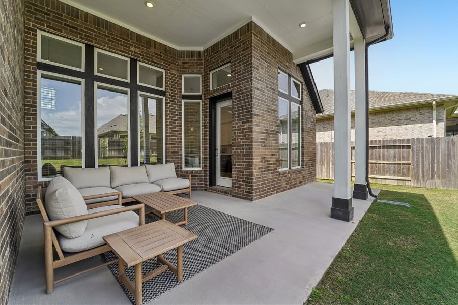 Exterior details and patio area of a home in ARTAVIA, Conroe (Image 2).