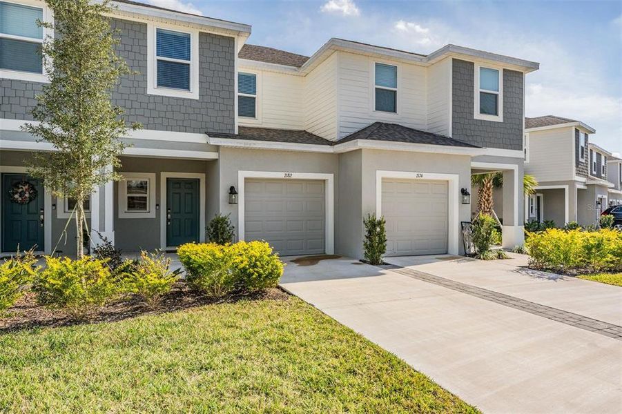 Front exterior of a new home in , Wesley Chapel, FL, highlighting curb appeal (Image 1). Front exterior of a new home in , Wesley Chapel, FL, highlighting curb appeal (Image 1).
