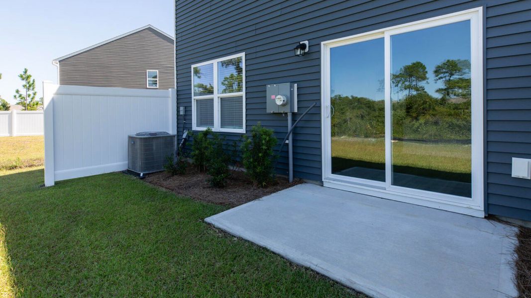 Front exterior of a new home in Grayson Park Townhomes, Leland, NC, highlighting curb appeal (Image 2).