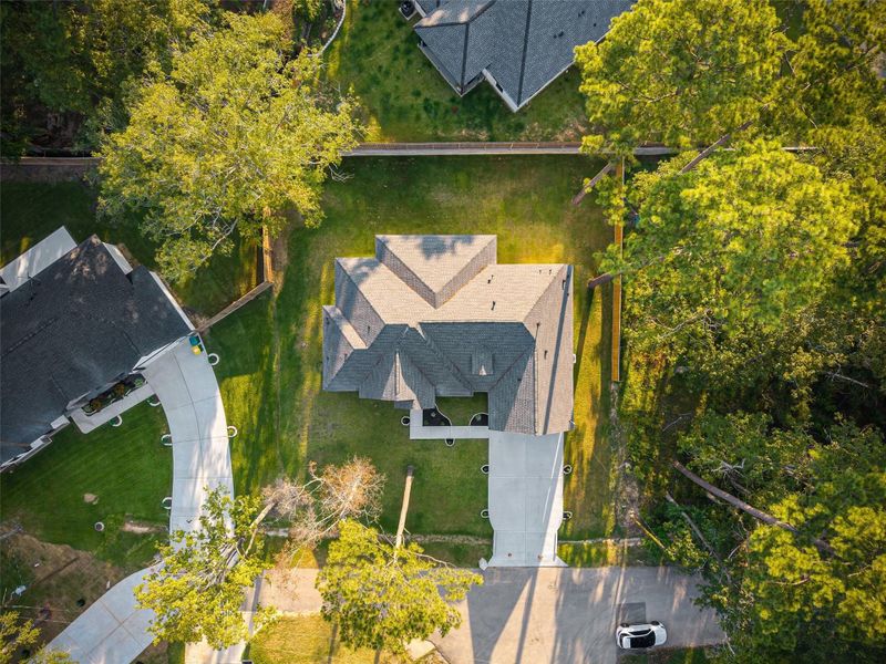 Front exterior of a new home in , Conroe, TX, highlighting curb appeal (Image 25).
