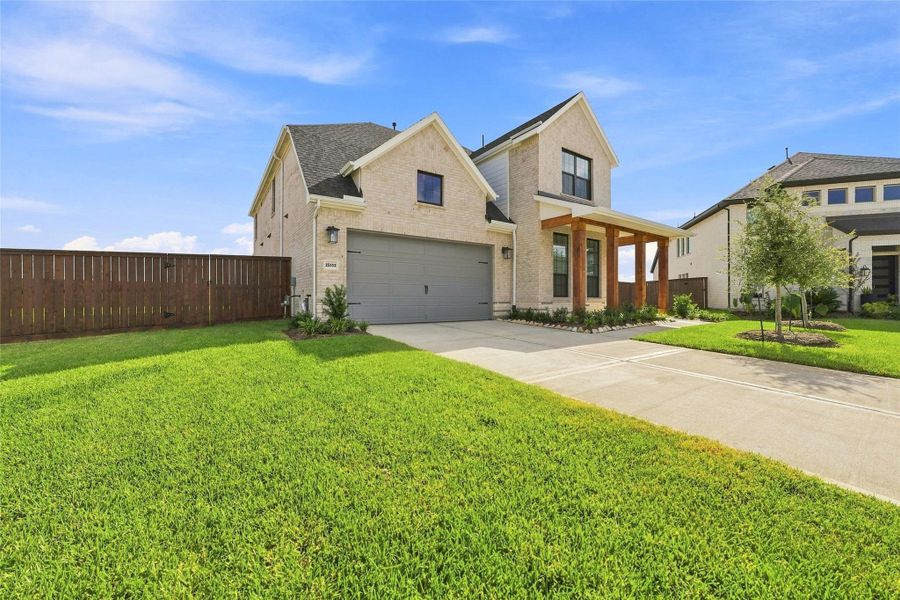 Front exterior of a new home in Katy Court, Katy, TX, highlighting curb appeal (Image 21).