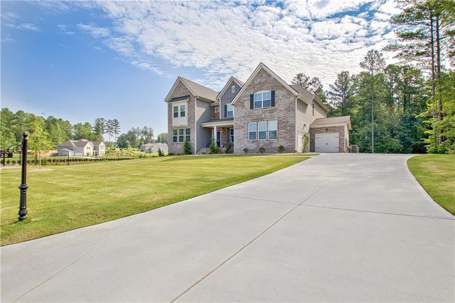 Front exterior of a new home in Genesee, Newnan, GA, highlighting curb appeal (Image 25).