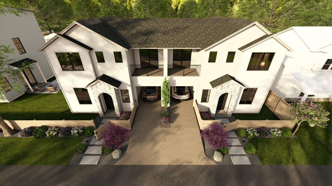 View of front facade with stone siding, a front yard, stucco siding, roof with shingles, and driveway