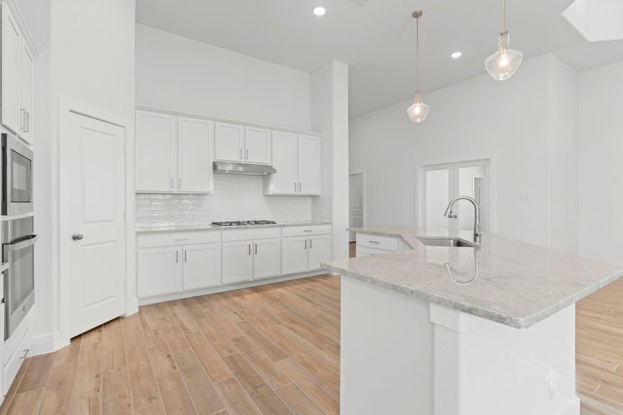 This gourmet kitchen will surround you with beautiful tall shaker cabinets, gorgeous granite countertops, deep stainless steel undermount sink, pull out swan kitchen faucet and more!