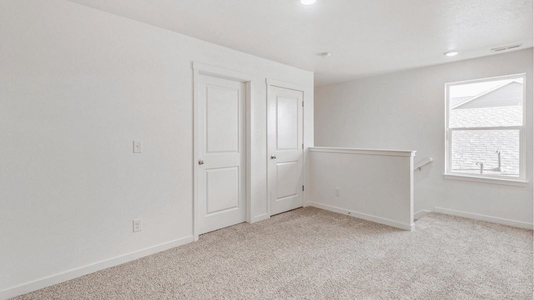 Representative unfurnished interior of a home built from the Elm by D.R. Horton in The Ridge at Lorson Ranch, Colorado Springs (Image 12).