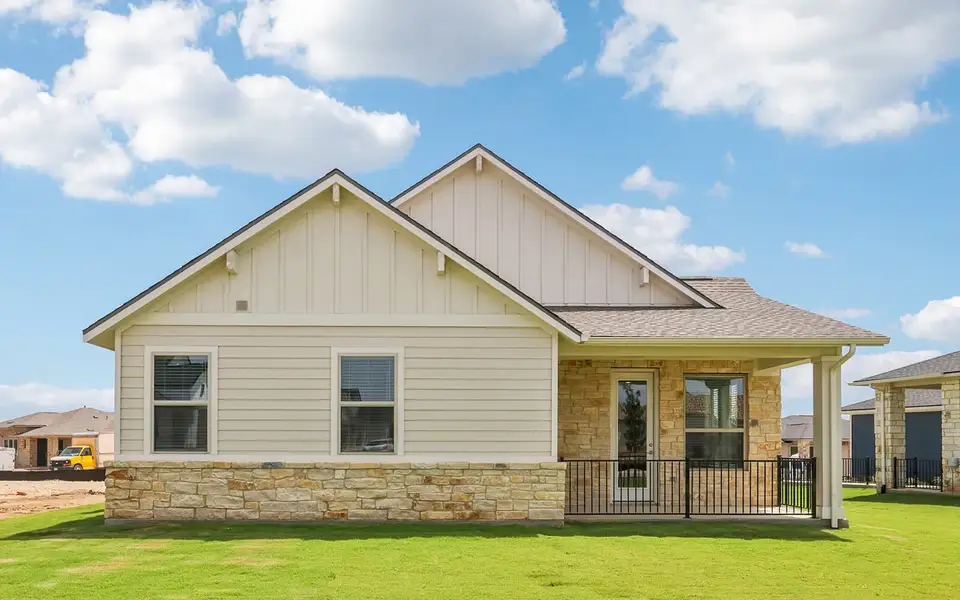 Front exterior of a new home in Cottage at Kissing Tree, San Marcos, TX, highlighting curb appeal (Image 2).