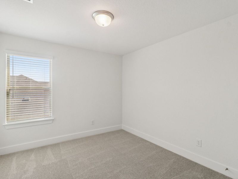 Guest bedroom in the Matador floorplan at a Meritage Homes community. Guest bedroom in the Matador floorplan at a Meritage Homes community.