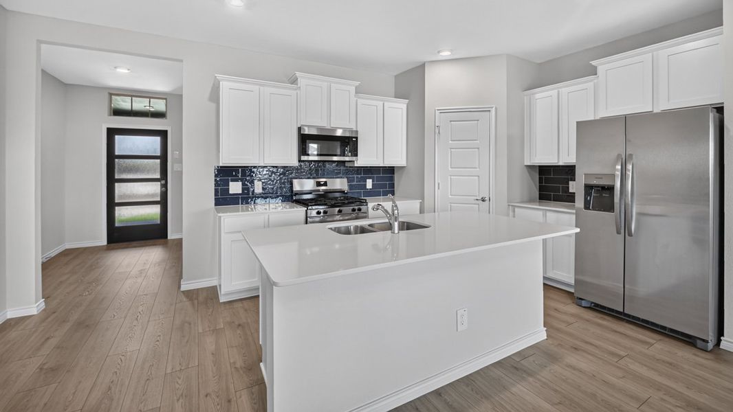 Representative furnished interior of a home built from the H231 Copaiba by D.R. Horton in Lilybrooke at Legacy Hills, Celina (Image 5).