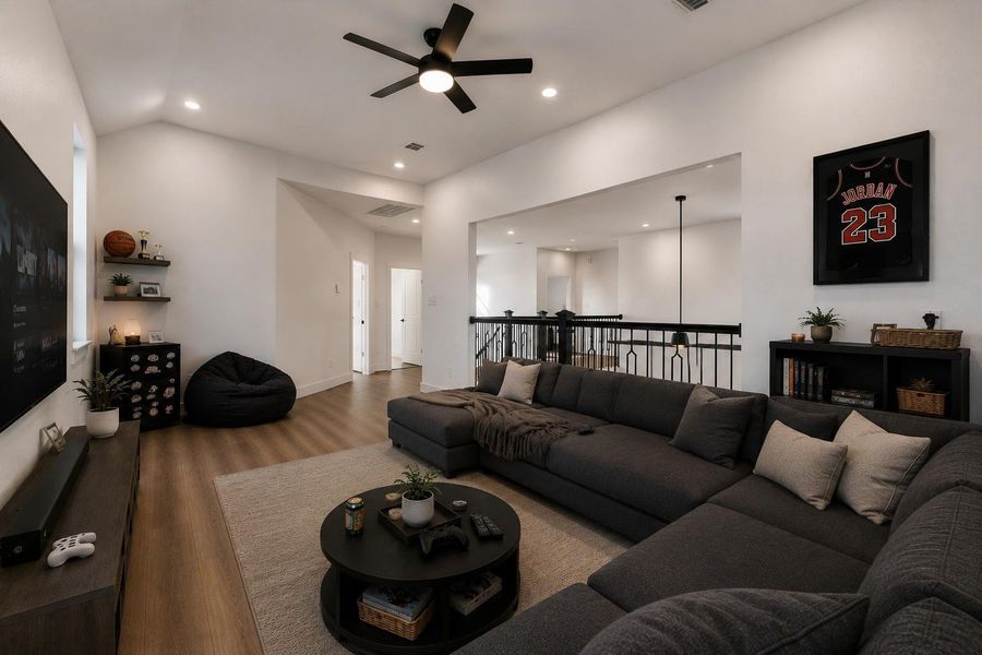 An upstairs family room offers flexible use as a game room, media room, or play area.