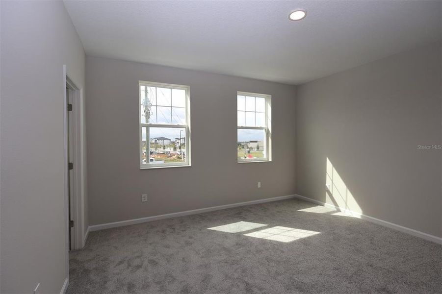 Spacious, unfurnished interior of a new home in Tribute at Ovation, Winter Garden (Image 25).