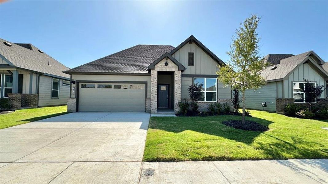 Front exterior of a new home in Rock Creek Ranch, Fort Worth, TX, highlighting curb appeal (Image 12). Front exterior of a new home in Rock Creek Ranch, Fort Worth, TX, highlighting curb appeal (Image 12).