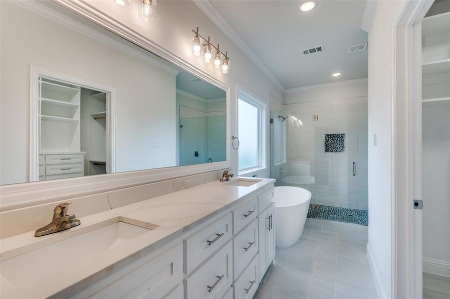 Bathroom with shower with separate bathtub, tile patterned flooring, and dual bowl vanity