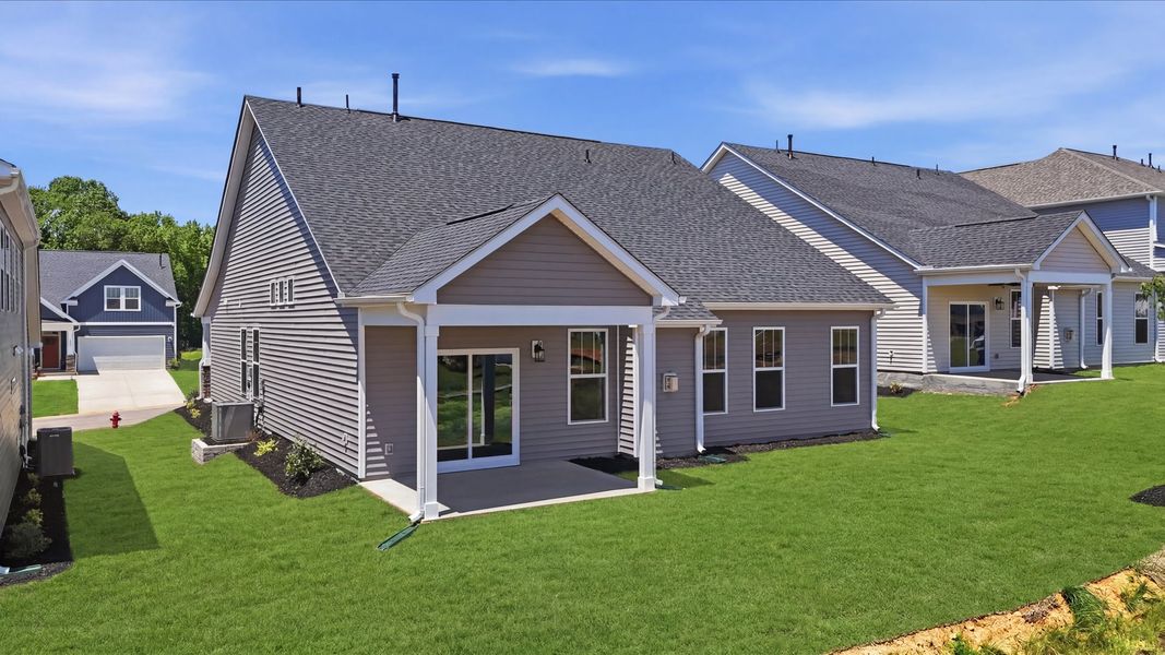 Warm and inviting outdoor living space with a covered rear porch and tasteful finishes in Moore, SC